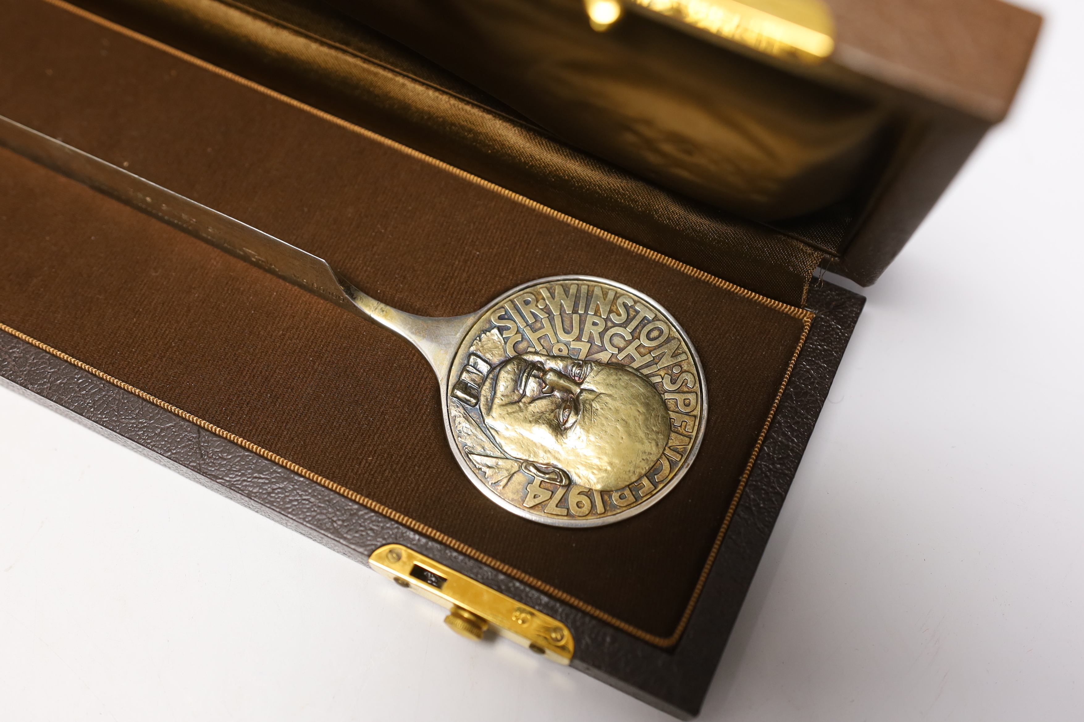A Churchill silver letter opener and a commemorative Churchill decanter, Garrard & Co, boxed, letter opener 24.5cm long